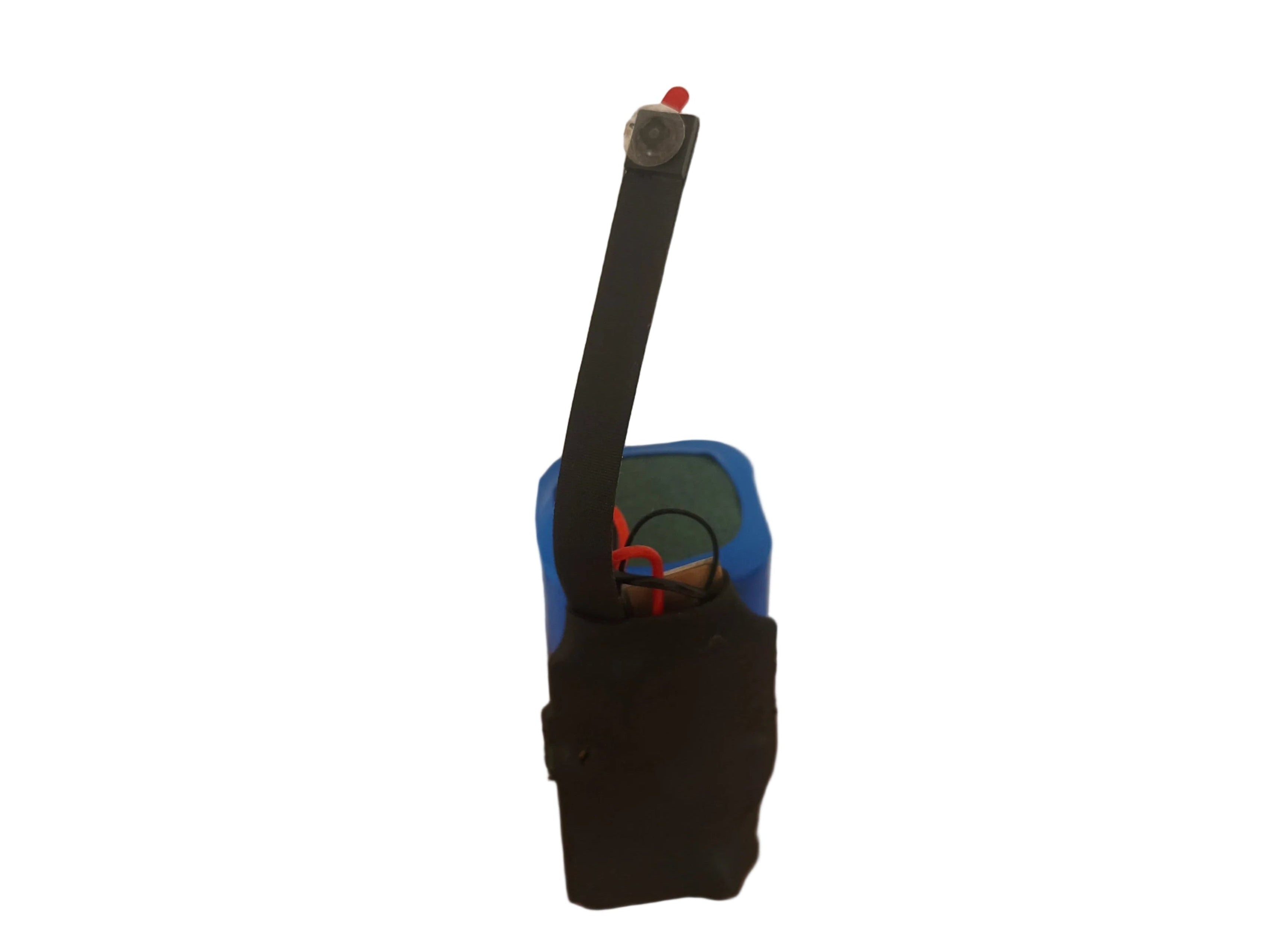 Small electronic device with a black antenna on a wooden surface